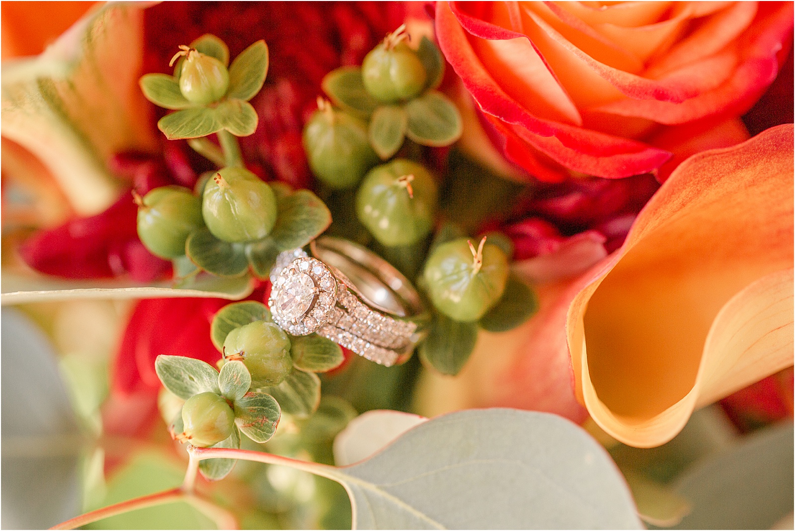 Modern diamond ring resting in bridal flowers