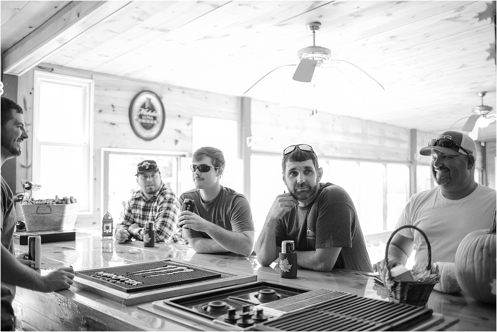 Groomsmen hanging out at a bar relaxing before wedding
