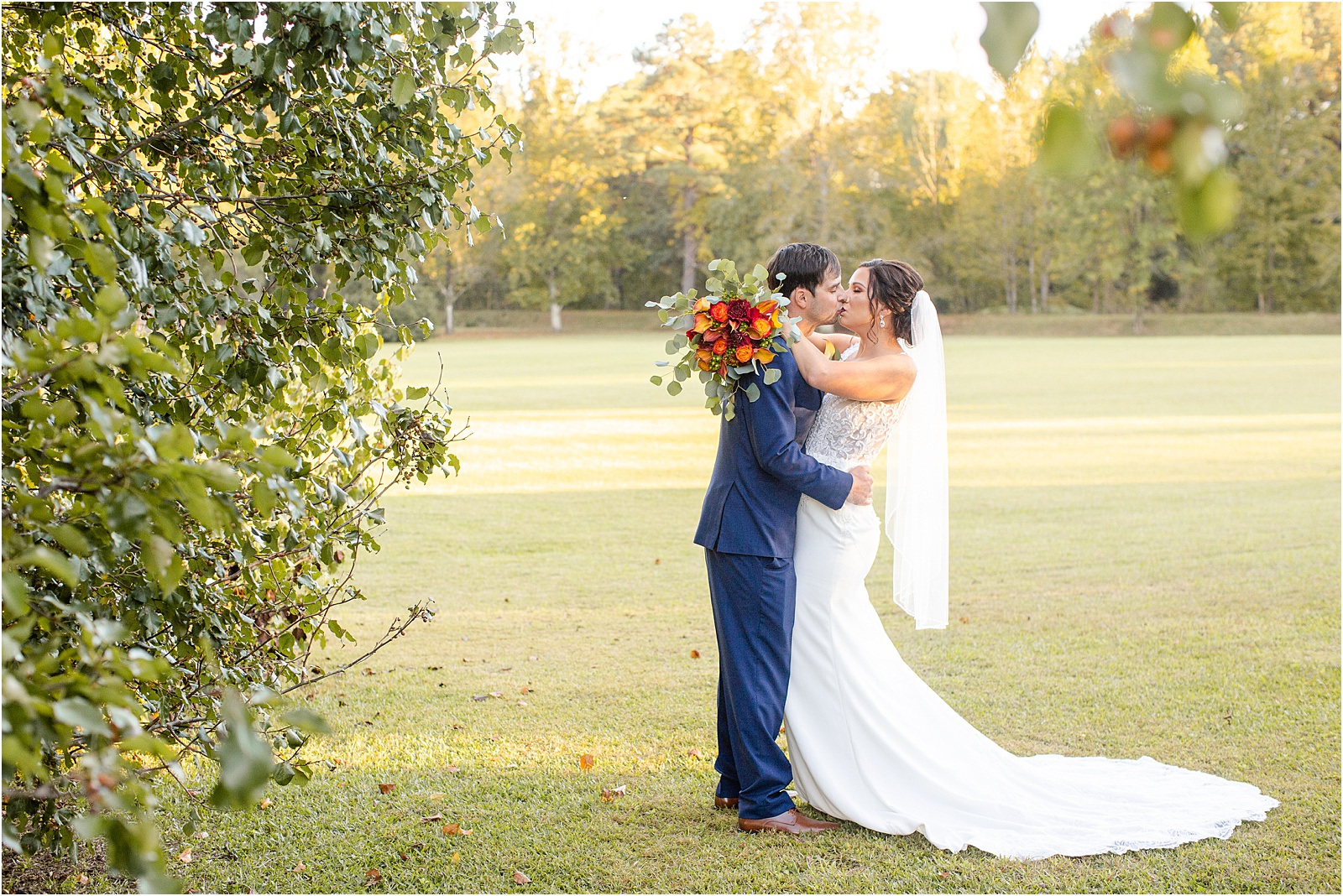 Married couple kissing after their wedding at a barn venue in Columbia, SC