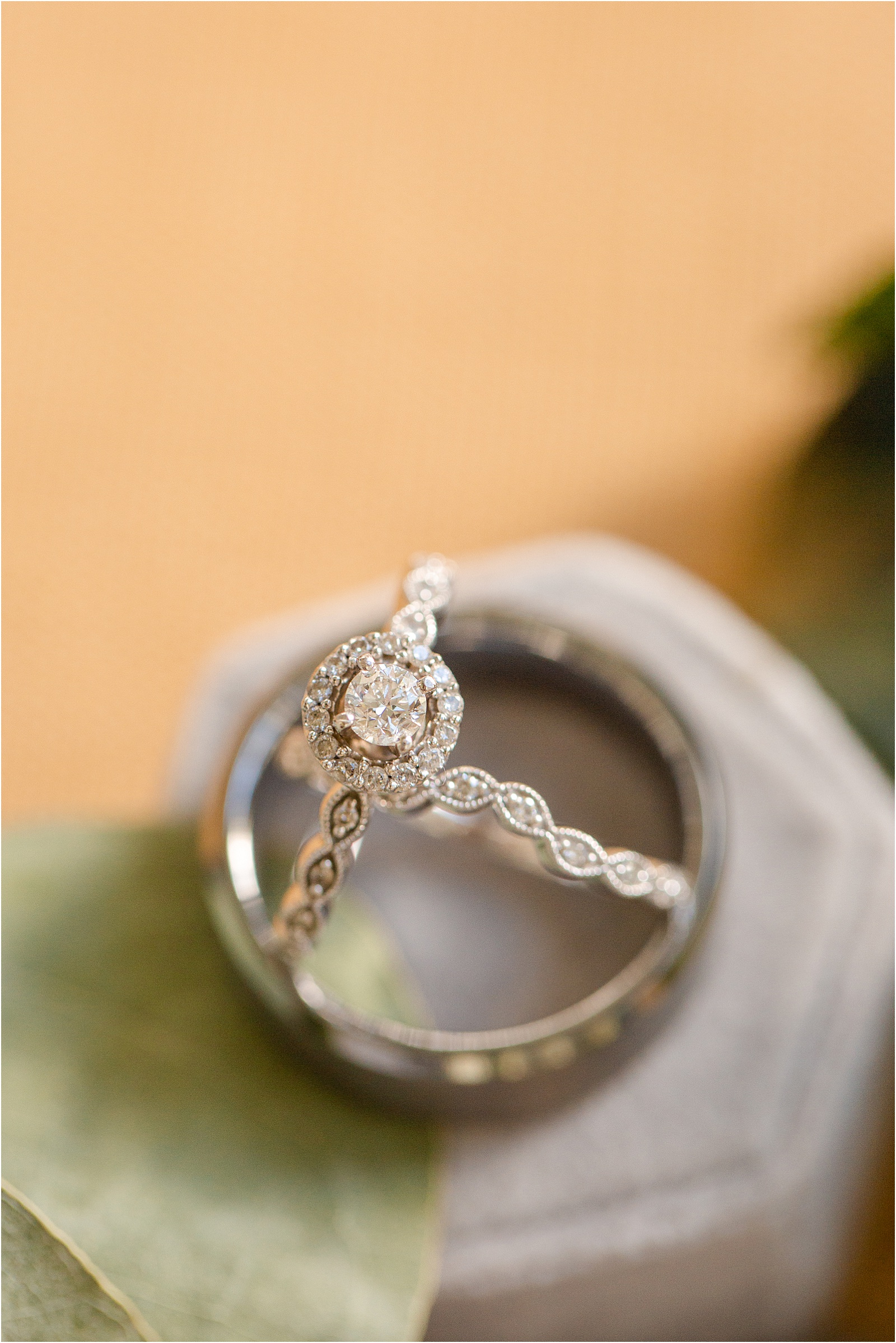 Diamond engagement ring inside of men's wedding ring