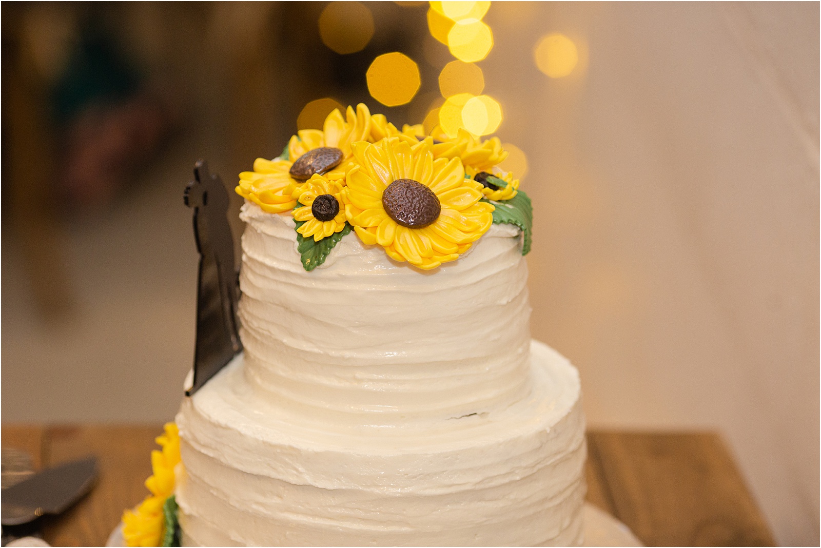 Wedding cake decorated with yellow sunflowers