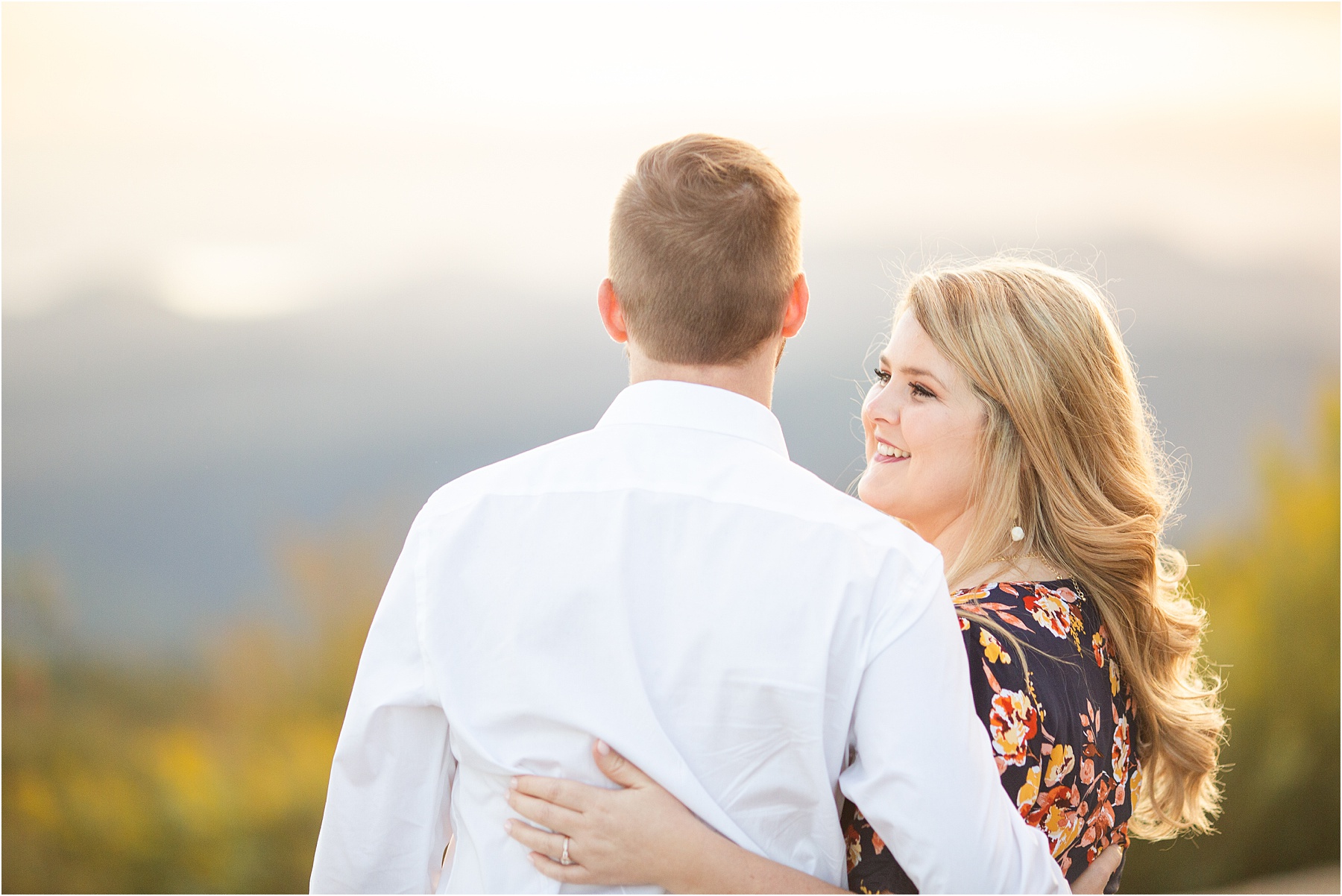 Girl smiling at her fiancé during engagement pictures