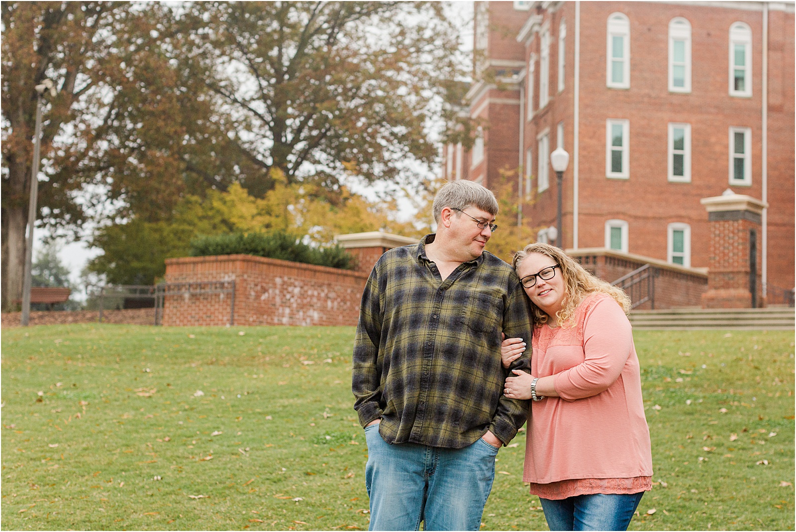 Clemson South Carolina couple hugging in front of Tillman Hall on Clemson University campus