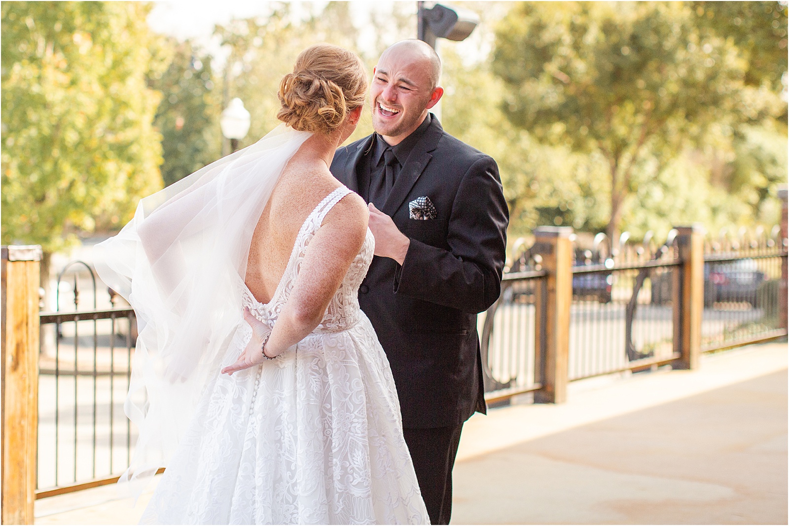 bride and groom laugh before they get married