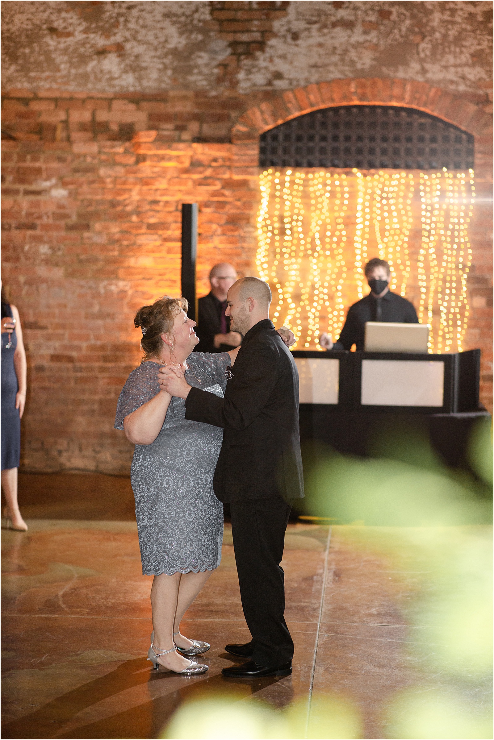 son dancing with his mom at wedding reception