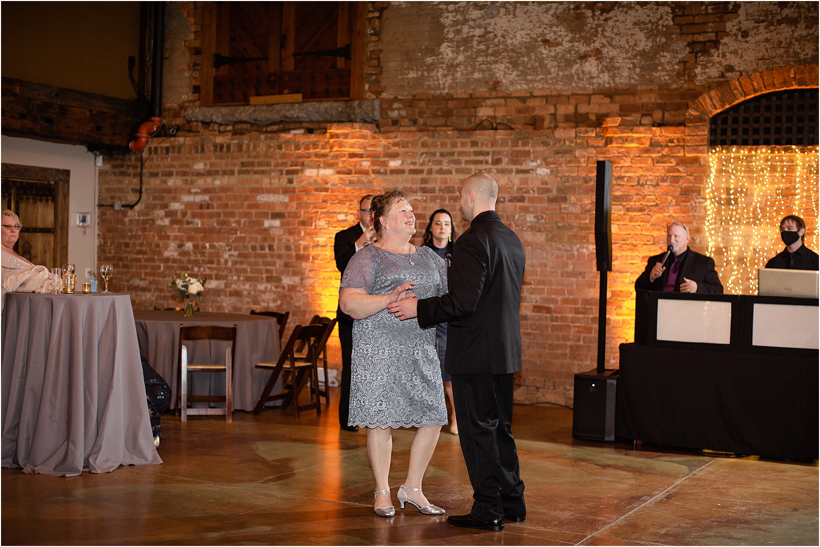 groom dancing with his mom at a wedding at old cigar warehouse