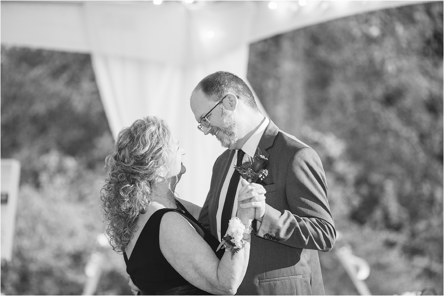 black and white picture of man dancing with mom
