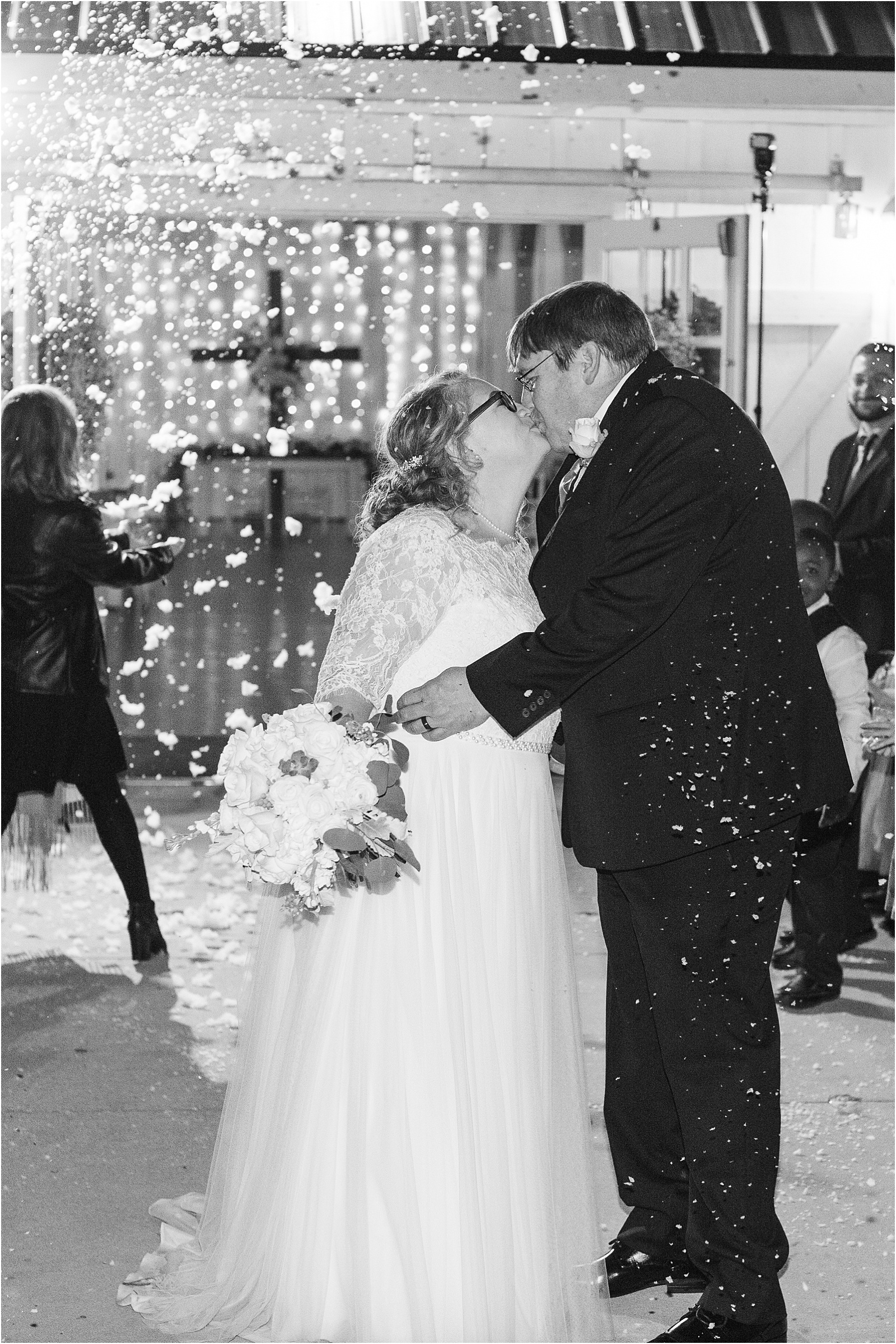Christmas wedding couple leaving their reception in snow