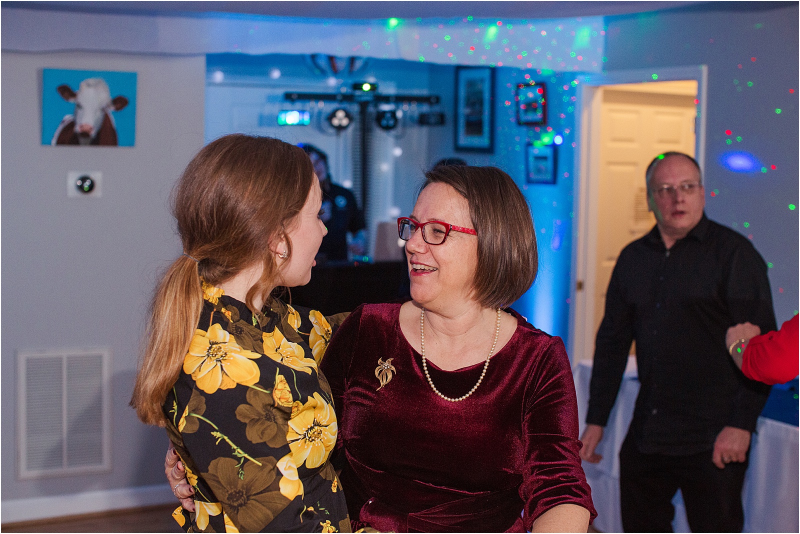 mom and daughter dancing at a house party