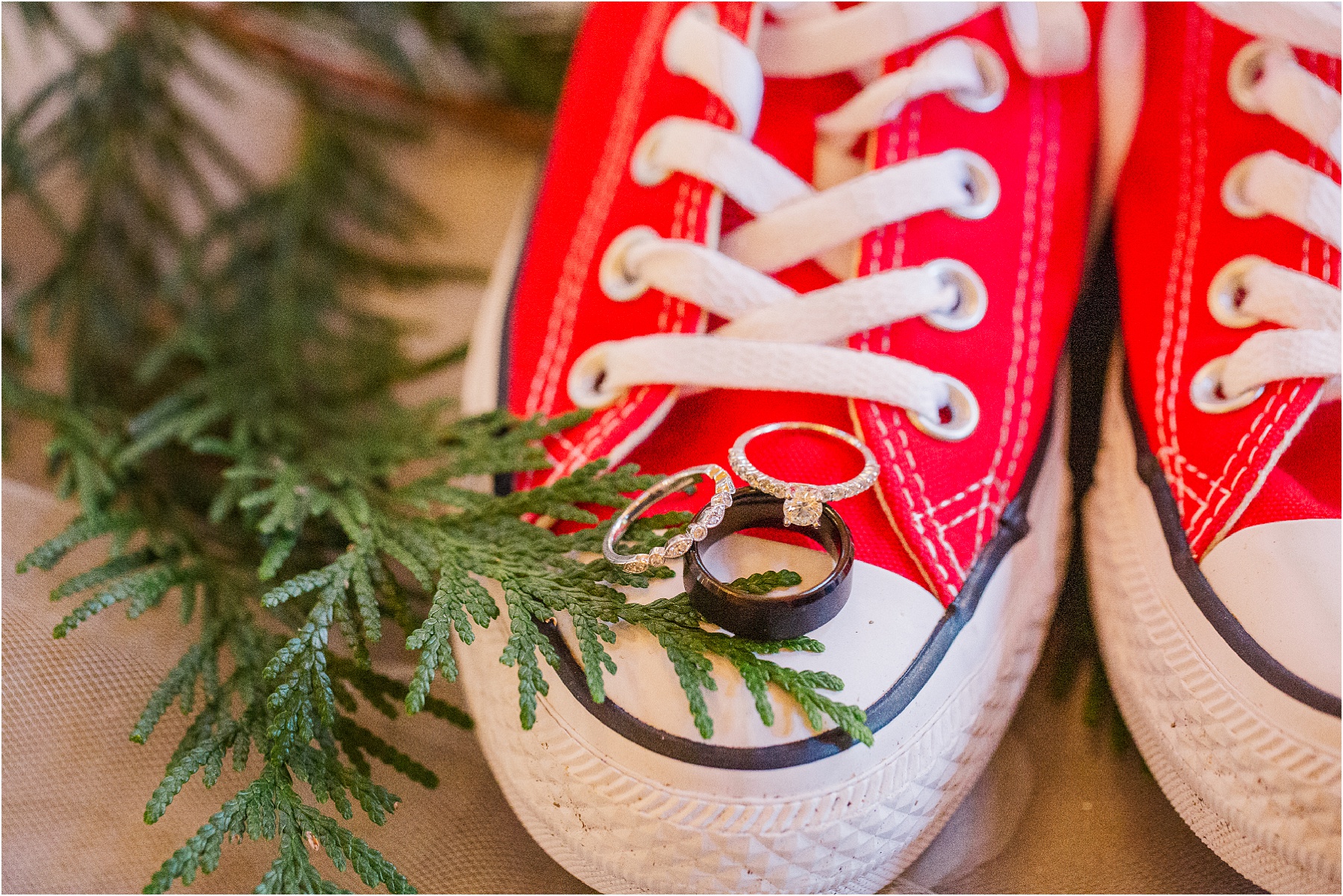weddings bands on top of red converses