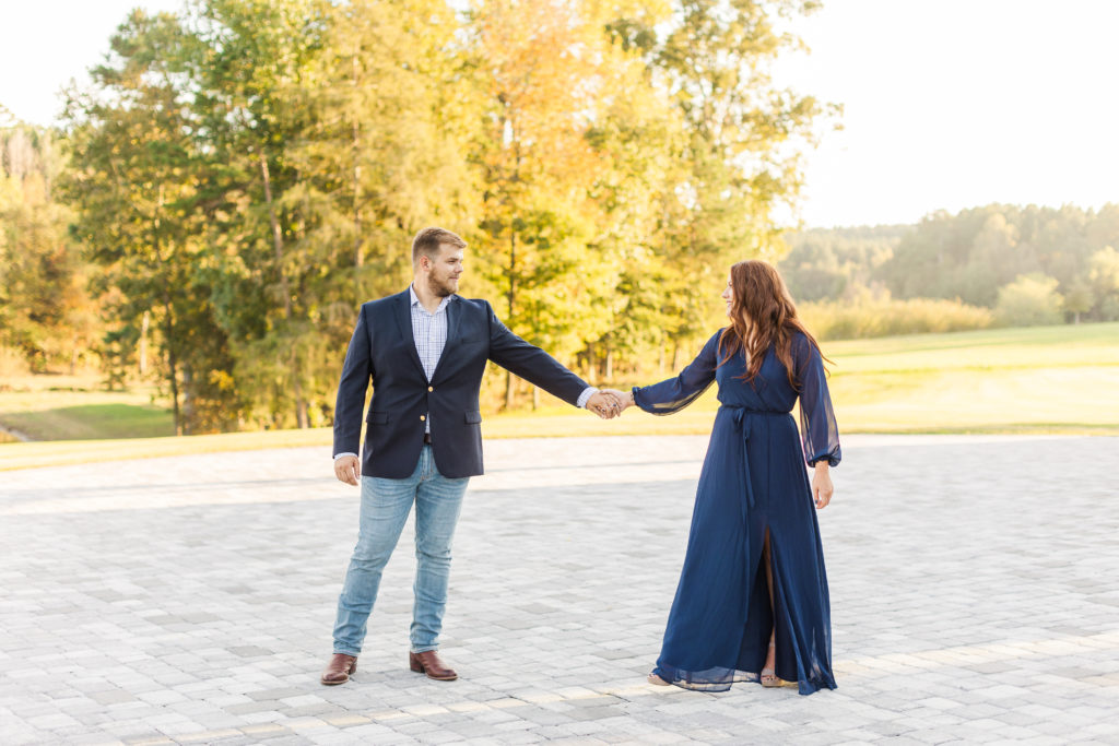 dancing couple on a patio for engagement pictures