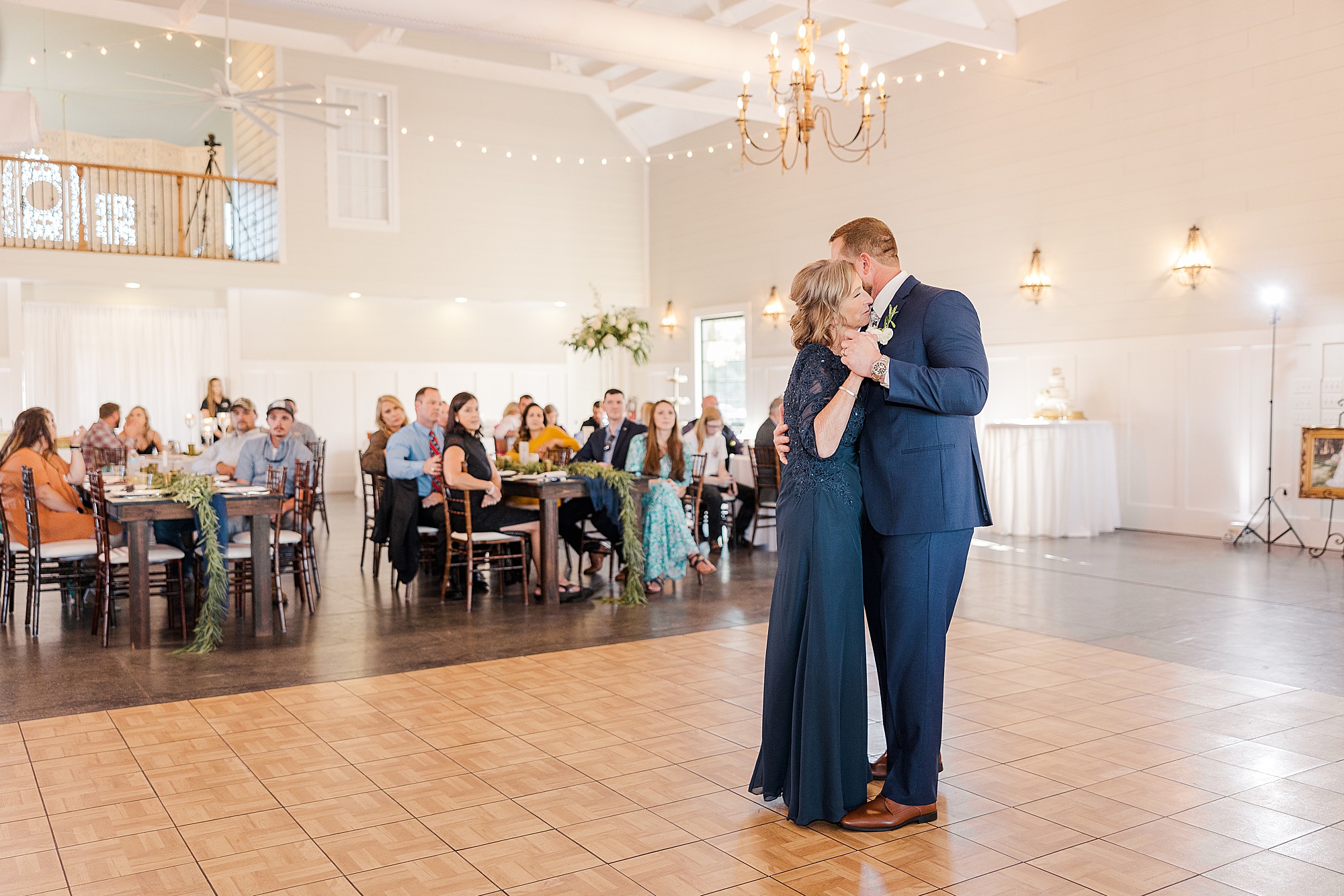 groom dancing with his mom at wedding